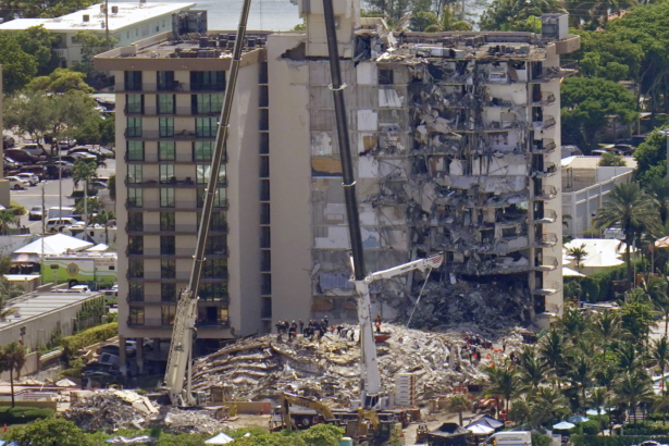 This aerial image shows an oceanfront condo building that partially collapsed on June 24, with many people still unaccounted for, in Surfside, Fla., on June 27, 2021. (Gerald Herbert/AP Photo)