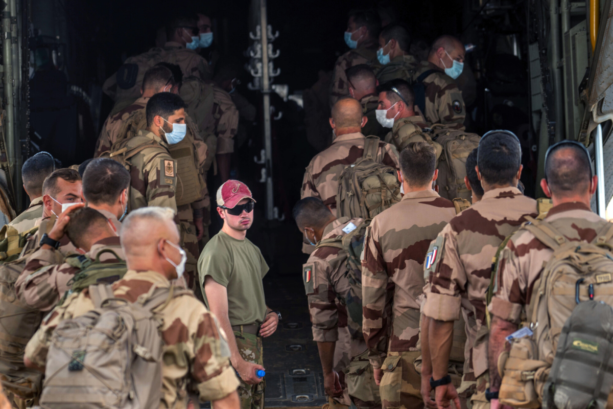 French Barkhane force soldiers who wrapped up a four-month tour of duty in the Sahel board a US Air Force C130 transport plane, leave their base in Gao, Mali, on June 9, 2021. (Jerome Delay/AP Photo)