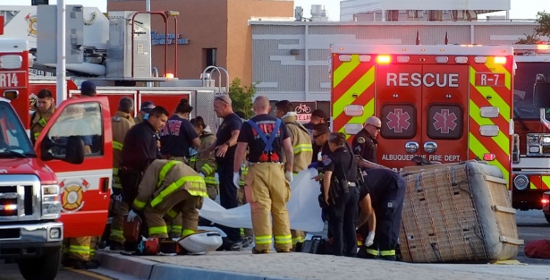 Albuquerque Fire Rescue crews work on victims of the fatal balloon crash at Unser and Central SW in Albuquerque, N.M., on June 26, 2021. (Adolphe Pierre-Louis/The Albuquerque Journal via AP)