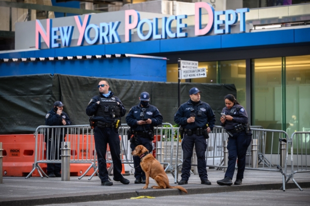 New York Police Department (NYPD) officers stand on Times Square in New York, on May 9, 2021. (Ed Jones/AFP via Getty Images)