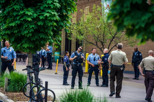 Police officers investigate a fatality in an officer involved shooting, in Minneapolis, Minn., on June 3, 2021. (Richard Tsong-Taatarii/Star Tribune via AP)