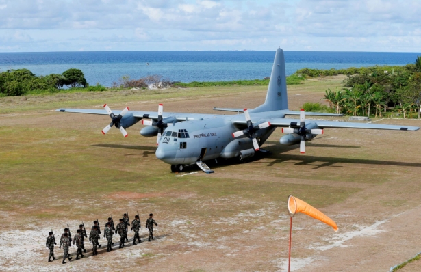 A Philippine air force C-130 transport plane as Philippine troops march at the Philippine-claimed Thitu Island off the disputed Spratlys chain of islands in the South China Sea in western Philippines, on April 21, 2017. (Bullit Marquez/File/AP Photo)