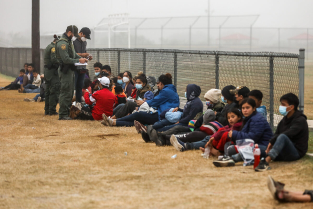 A group of illegal immigrants is processed by Border Patrol after crossing the U.S.-Mexico border in La Joya, Texas, on April 10, 2021. (Charlotte Cuthbertson/The Epoch Times)