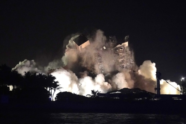 The remaining structure of the Champlain Towers South condo building is demolished more than a week after it partially collapsed, late Sunday, July 4, 2021, in Surfside, Fla. (AP Photo/Lynne Sladky)