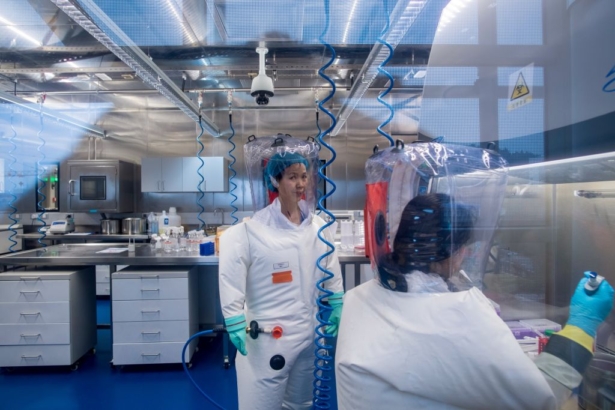 Chinese virologist Shi Zhengli (L) is seen inside the P4 laboratory