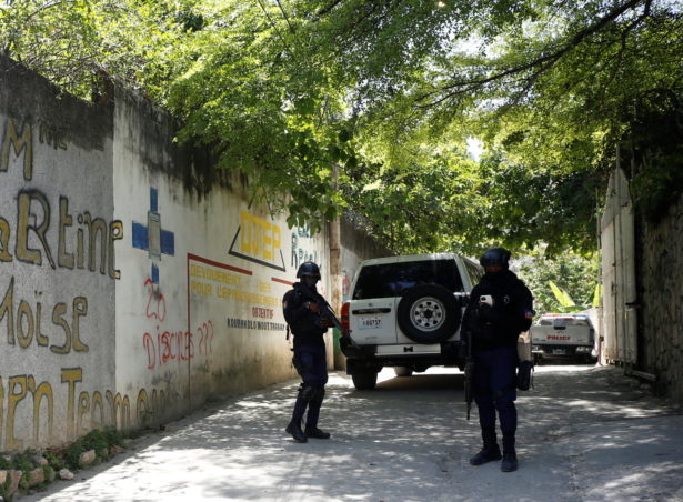 Police stand guard near the private residence of Haiti's President Jovenel Moise after he was shot dead by gunmen with assault rifles, in Port-au-Prince, Haiti, on July 7, 2021. (Estailove St-Val/Reuters)