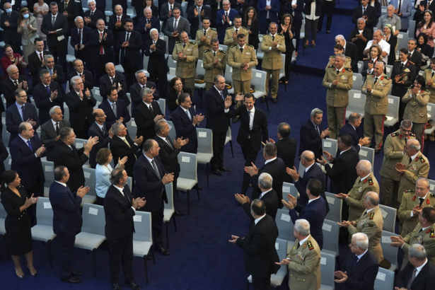 Syrian President Bashar Assad, center, waves to his supporters upon arrival to takes the oath of office for a fourth seven-year term, at the Syrian Presidential Palace in the capital Damascus, Syria, on July 17, 2021. (Syrian Presidency via Facebook via AP)