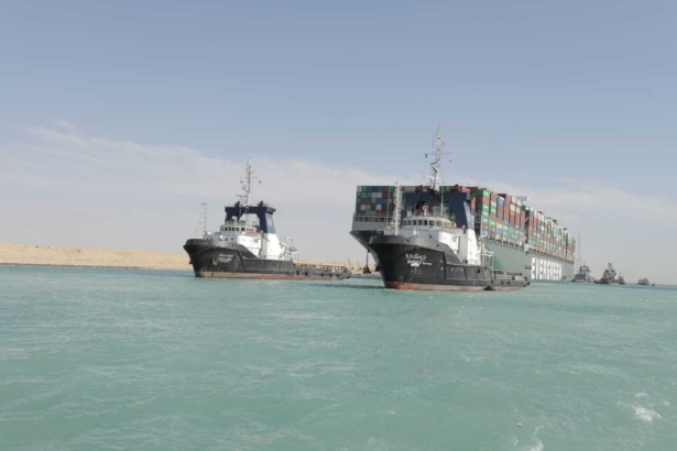 Released by Suez Canal Authority, the Ever Given, a Panama-flagged cargo ship is accompanied by Suez Canal tugboats as it moves in the Suez Canal, Egypt, on March 29, 2021. (Suez Canal Authority via AP)