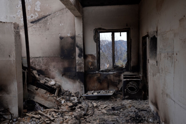 A burned house is seen on Troodos mountain, in Ora village, southwestern Cyprus, on July 4, 2021. (Petros Karadjias/AP Photo)