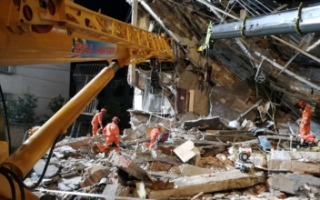 China Hotel Collapse Kills Eight; Rescuers Search for Nine Missing