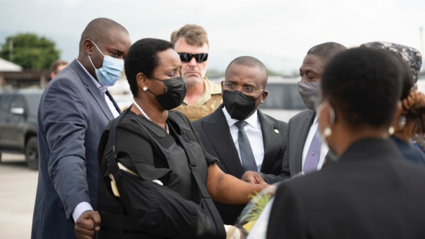 Haiti's First Lady Martine Moise, wearing a bullet proof vest and her right arm in a sling, arrives at the Toussaint Louverture International Airport, in Port-au-Prince, Haiti, on July 17, 2021. (Haiti's Secretary of State for Communication Photo/via AP)