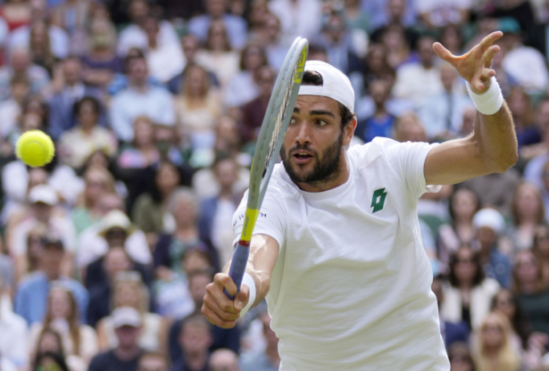 Italy's Matteo Berrettini plays a return to Serbia's Novak Djokovic during the men's singles final on day 13 of the Wimbledon Tennis Championships in London on July 11, 2021. (Kirsty Wigglesworth/AP Photo)