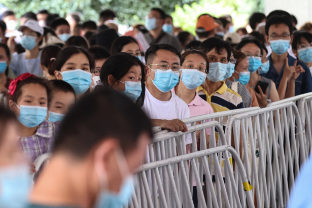Residents queue to receive nucleic acid tests for the COVID-19 in Nanjing, in eastern Jiangsu province, China, on July 21, 2021. (STR/AFP via Getty Images)