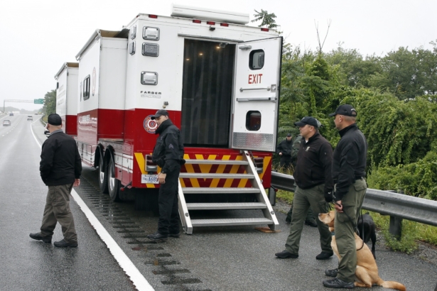 Police work on in the area of an hours long standoff with a group of armed men that partially shut down interstate 95, in Wakefield, Mass., on July 3, 2021. (Michael Dwyer/AP Photo)