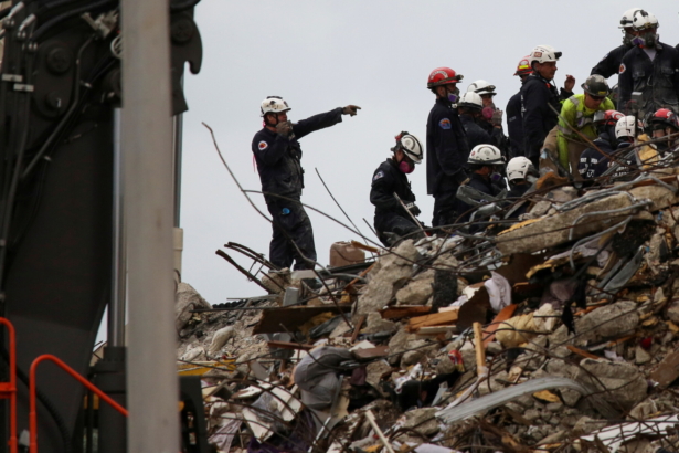 Rescue personnel continue the search and rescue operation for survivors at the site of a partially collapsed residential building in Surfside, near Miami Beach, Fla., on June 30, 2021. (Marco Bello/File Photo/Reuters)