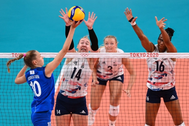 (L-R) Russia's Arina Fedorovtseva hits the ball in front of USA's Michelle Bartsch-Hackley and Foluke Akinradewo in the women's preliminary round pool B volleyball match between USA and Russia during the Tokyo 2020 Olympic Games at Ariake Arena in Tokyo, Japan, on July 31, 2021. (Jung Yeon-Je/AFP via Getty Images)