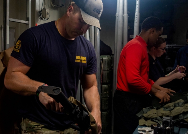 An Explosive Ordnance Disposal Technician, assigned to Explosive Ordnance Disposal Mobile Unit (EODMU) 5, prepares equipment in response to a call for assistance from the Mercer Street, a Japanese-owned Liberian-flagged tanker managed by Israeli-owned Zodiac Maritime, in the Arabian Sea, on July 30, 2021. (U.S. Navy/Handout via Reuters)