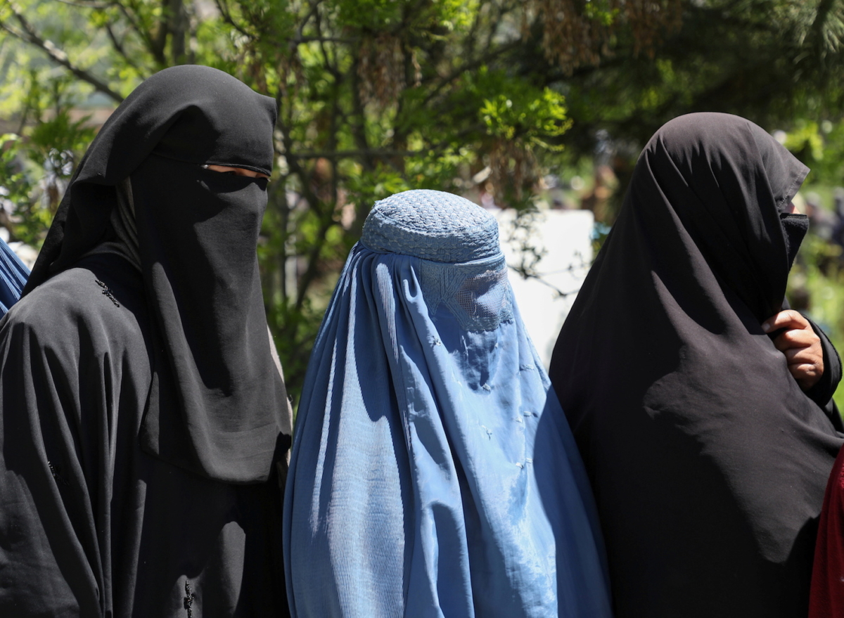 Afghan women wait to receive free wheat donated by the Afghan government during a quarantine, amid concerns about COVID-19 in Kabul, Afghanistan on April 21, 2020. (Stringer/File Photo/Reuters)