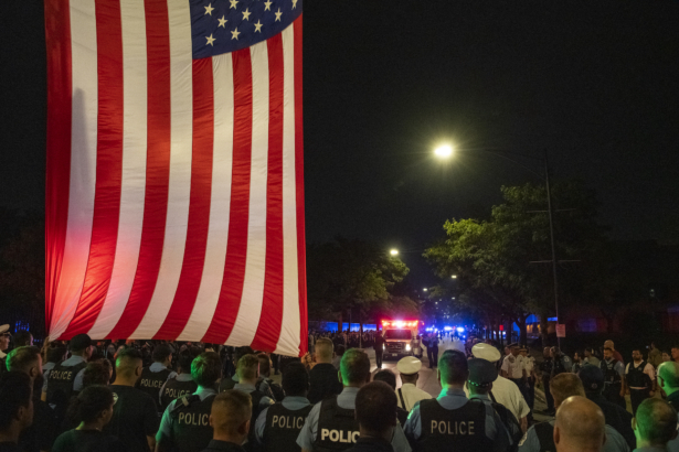 A Chicago police procession for a police officer who was shot and killed earlier during a traffic stop at 63rd and Bell drives by the Cook County Medical Examiners Office in Chicago, Ill., on Aug. 8, 2021. (Tyler LaRiviere/Sun-Times)