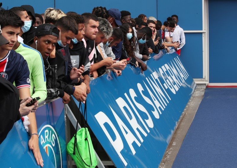 Fans await the arrival of Lionel Messi in Paris before his expected signing for Paris St Germain at Parc des Princes, Paris, France on Aug. 9, 2021 (Yves Herman/File Photo/Reuters)