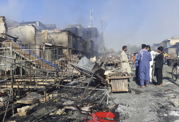 Afghans inspect damaged shops after fighting between Taliban and Afghan security forces in Kunduz city, northern Afghanistan, on Aug. 8, 2021. (Abdullah Sahil/AP Photo)