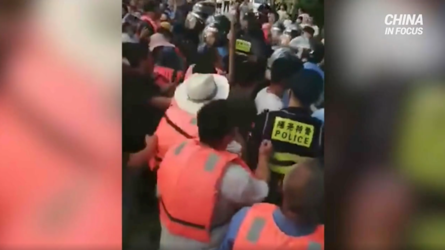 Villagers Clash With Police Digging Levee Open