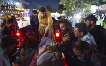 13 US Service Members Killed in Afghanistan Bombings; Biden Promises to Retaliate
