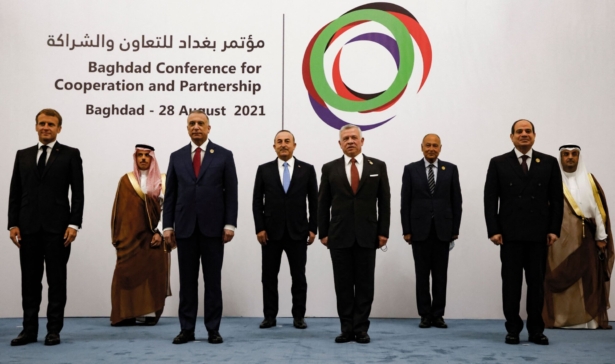 (L–R) French President Emmanuel Macron, Saudi Foreign Minister Faisal bin Farhan, Iraq's Prime Minister Mustafa al-Kadhemi, Turkey's Foreign Minister Mevlut Cavusoglu, Jordan's King Abdullah II, Arab League Secretary General Ahmed Aboul-Gheit, Egypt's President Abdel Fattah al-Sisi and secretary-general of the Gulf Cooperation Council (GCC) Nayef al-Hajraf pose for a group picture after the meeting in Baghdad, Iraq, on Aug. 28, 2021. (Ludovic Marin/Pool/AFP via Getty Images)