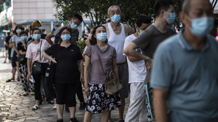 Wuhan Ramps Up Quarantine For 'Same-Area Visitors'
