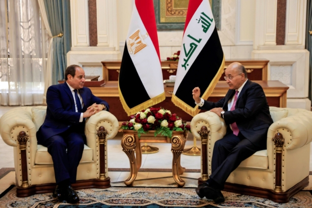 Iraq's President Barham Salih meets Egyptian President Abdel Fattah al-Sisi ahead of the Baghdad summit at the Green Zone in Baghdad, Iraq, on Aug. 28, 2021. (Thaier Al-Sudani/Reuters)