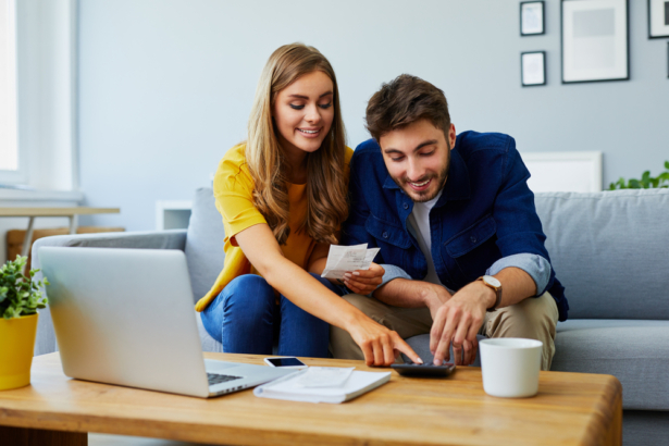 Two people working together. (baranq/Shutterstock)