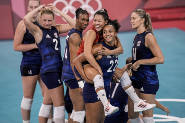 United States players celebrate after winning the women's volleyball semifinal match between Serbia and United States at the 2020 Summer Olympics, in Tokyo, Japan, on Aug. 6, 2021. (Manu Fernandez/AP Photo)