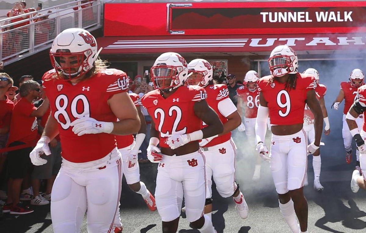 Utah cornerback Aaron Lowe (22) runs with his teammates onto the field before an NCAA college football game against Washington State in Salt Lake City, Utah, on Sept. 25, 2021. (George Frey/AP Photo)