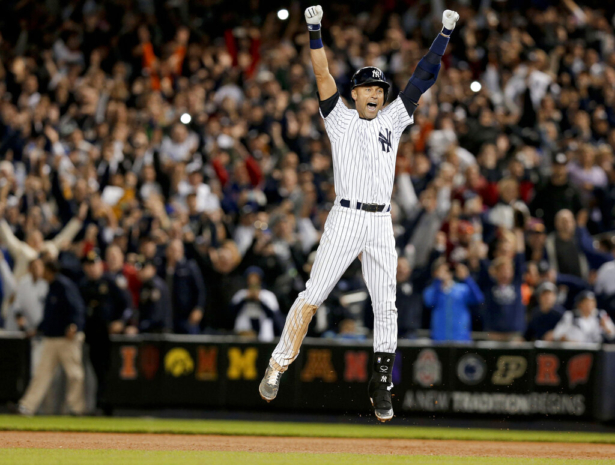 New York Yankees' Derek Jeter jumps after hitting the game-winning single against the Baltimore Orioles in the ninth inning of a baseball game, in New York, on Sept. 25, 2014. (Julie Jacobson/AP Photo)