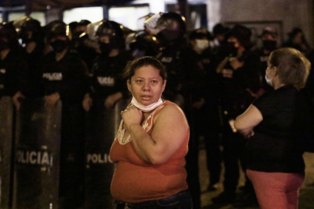 Relatives of inmates wait for news outside the Litoral penitentiary after a riot, in Guayaquil, Ecuador, on Sept. 28, 2021. (Angel DeJesus/AP Photo)