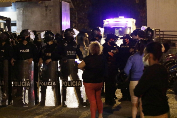 Relatives of inmates wait for news outside the Litoral penitentiary after a riot, in Guayaquil, Ecuador, on Sept. 28, 2021. (Angel DeJesus/AP Photo)