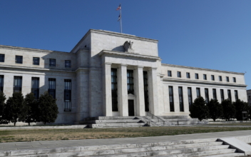 Fed Holds Interest Rates Near Zero, May Conclude Tapering by ‘Middle of Next Year’