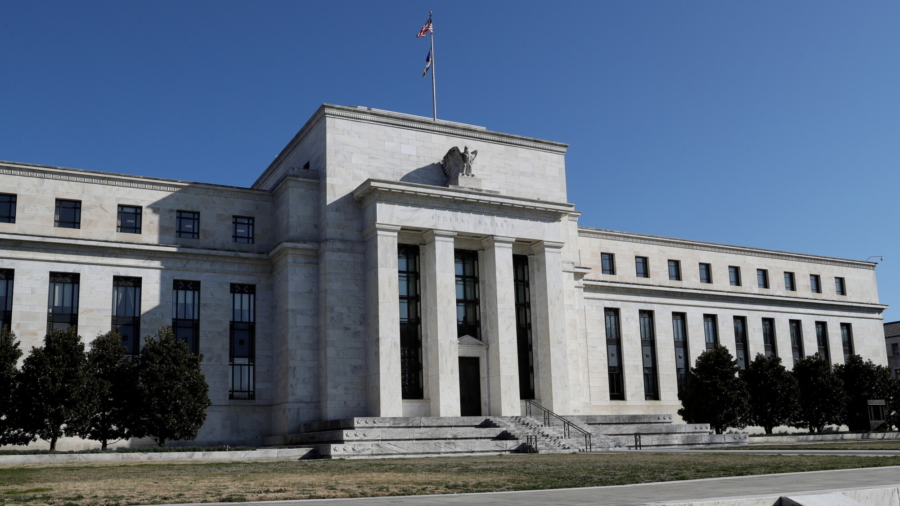 Fed Holds Interest Rates Near Zero, May Conclude Tapering by ‘Middle of Next Year’