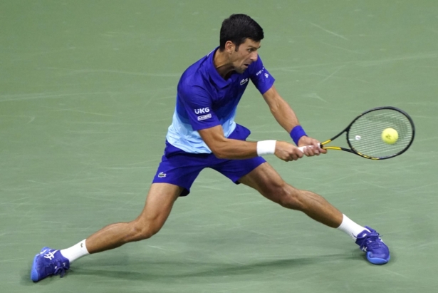 Novak Djokovic, of Serbia, returns against Jenson Brooksby, of the United States, during the fourth round of the U.S. Open tennis championships in New York on Sept. 6, 2021. (John Minchillo/AP Photo)