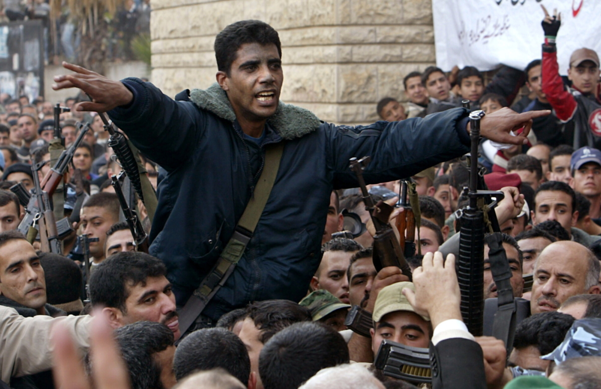 Palestinian commander of the Israeli-designated terrorist group Al Aqsa Martyrs Brigades Zakaria Zubeid is carried on the shoulders of supporters in Jenin, in the Israeli-occupied West Bank on Dec. 30, 2004. (Ammar Awad/Reuters)