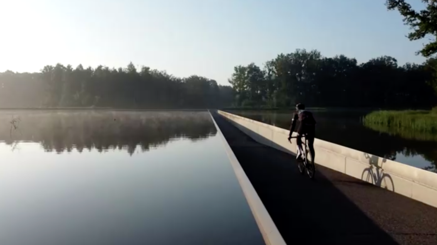 Cyclists Come Eye-to-Eye With Ducks on Bike Path That Cuts Through Lake in Belgium