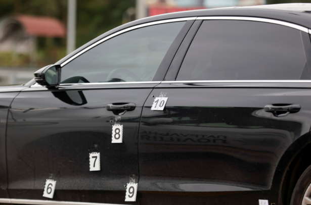 Markers are attached next to bullet holes in a car of Serhiy Shefir, Ukrainian President Volodymyr Zelenskiy's principal aide, following an assault outside the capital Kyiv, Ukraine, on Sept. 22, 2021. (Serhii Nuzhnenko/Reuters)