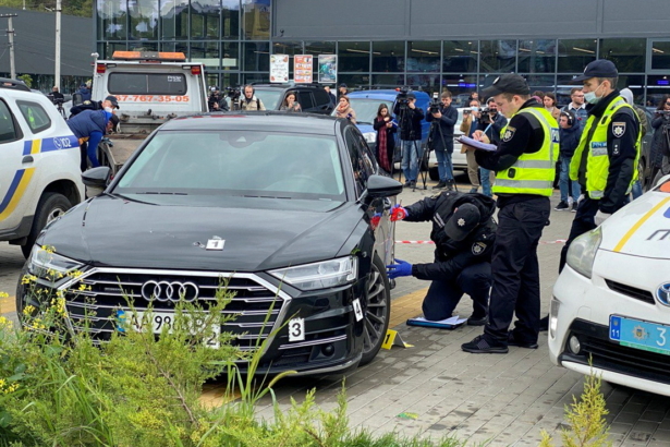 Investigators examine bullet holes in a car of Serhiy Shefir, Ukrainian President Volodymyr Zelensky's principal aide, following an assault outside the capital Kyiv, Ukraine, on Sept. 22, 2021. (Serhii Nuzhnenko/Reuters)