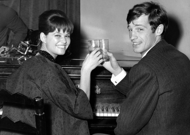 French actor Jean-Paul Belmondo and Italian actress Claudia Cardinale attend a cocktail party in the Foreign Press Association in Rome, Italy on Nov. 3, 1960. (Mario Torrisi/AP Photo)