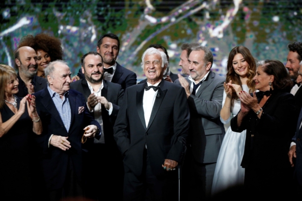 French actor Jean-Paul Belmondo (C) is congratulated by actors on stage during the ceremony of the 42nd Cesar Film Awards, at the Salle Pleyel, in Paris on Feb. 24, 2017. (Thibault Camus/AP Photo)