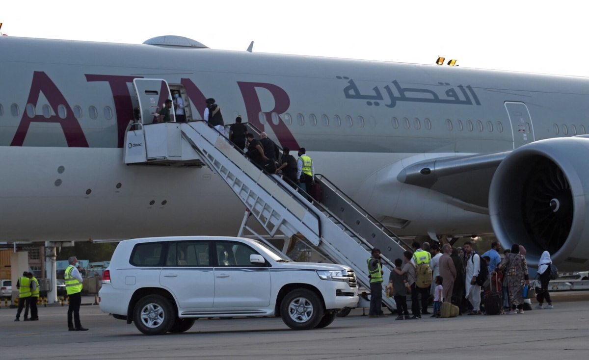 Passengers board a Qatar Airways aircraft at the airport in Kabul, Afghanistan, on Sept. 9, 2021. (Wakil Kohsar/AFP via Getty Images)