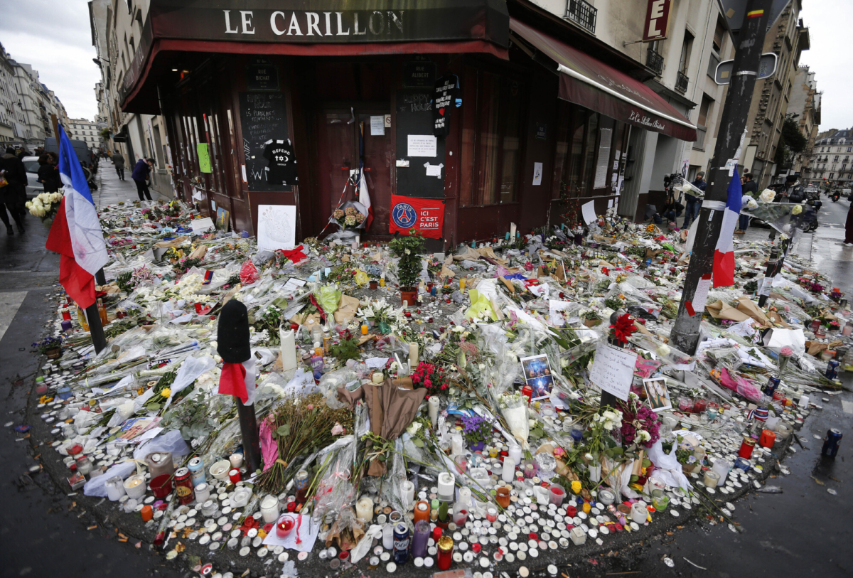 Flowers and candle tributes are placed at the Restaurant Le Carillon following the terrorist attacks in Paris, France, on Nov. 13, 2015. (Frank Augstein/AP/File)