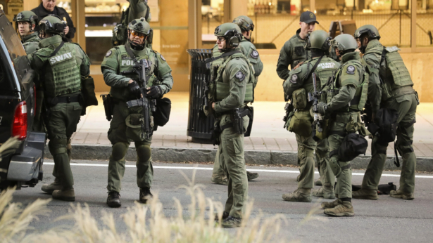 The Atlanta SWAT team stage in a street in Midtown Atlanta, Ga., on Oct. 20, 2021. (John Spink/Atlanta Journal Constitution via AP)