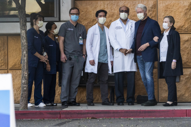 Former President Bill Clinton, and former First Lady and Secretary of State Hillary Clinton thank Alpesh N. Amin, MD, third from right, and the medical staff as he is released from the University of California Irvine Medical Center in Orange, Calif., on Oct. 17, 2021. (Damian Dovarganes/AP Photo)