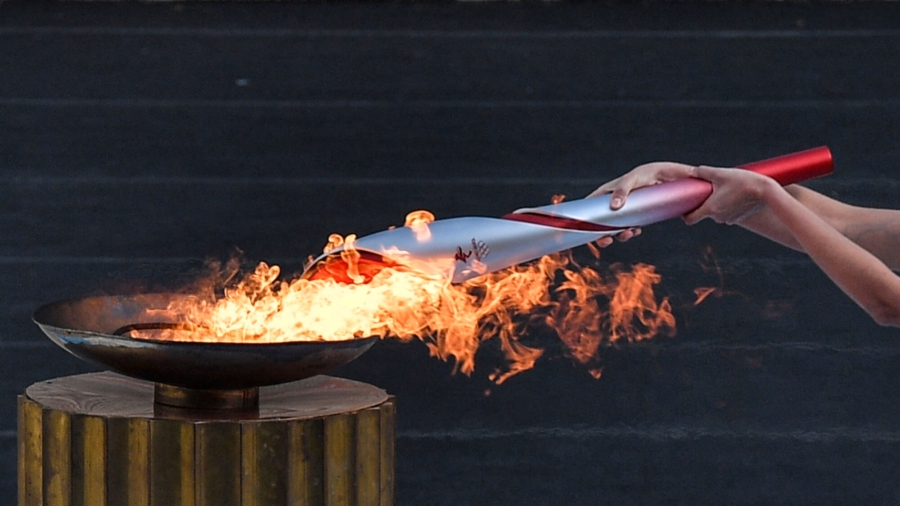 Beijing Lights Olympic Flame Amid Protests
